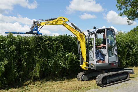 mini digger to remove hedge|hedge trimmer for mini excavator.